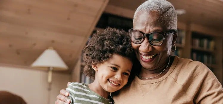 Image of an older woman hugging a child (not actual patients) mobile