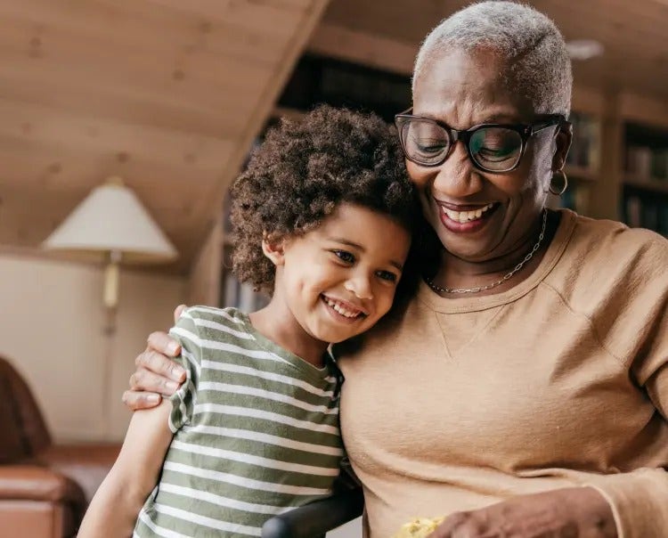 Image of an older woman hugging a child (not actual patients) mobile