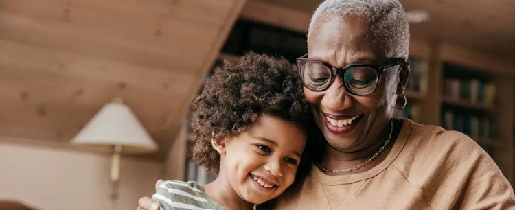 Image of an older woman hugging a child (not actual patients)